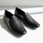 Black woven leather loafers for men with slip-on design and premium finish